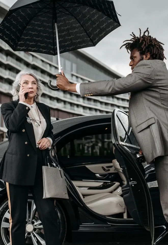 Security officer escorting a client to her car
